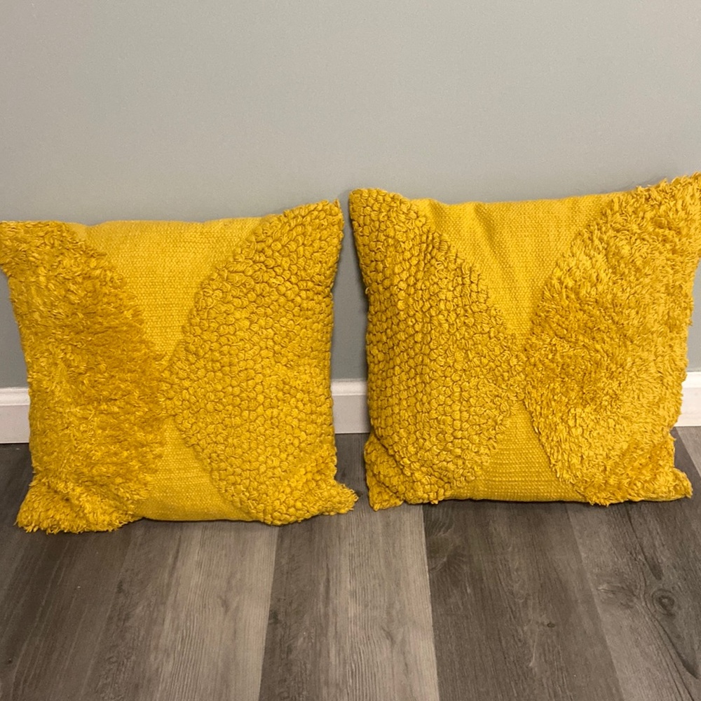 Gold in color accent pillows